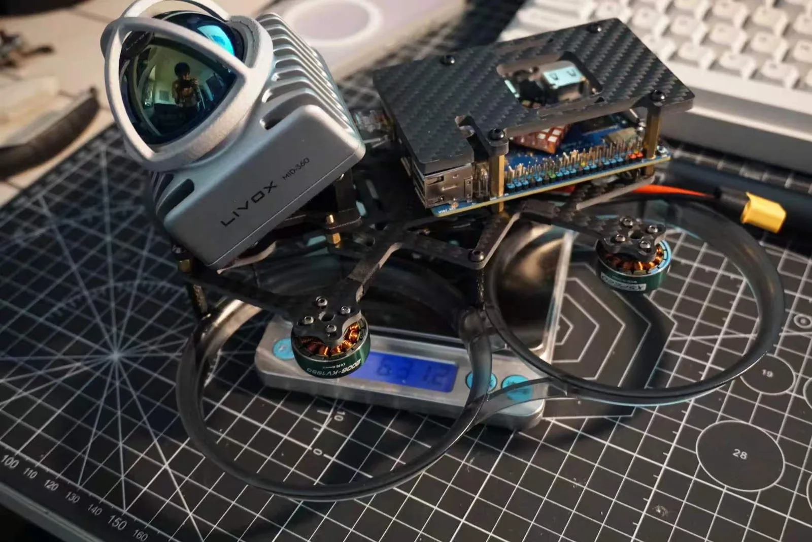 Close view of the UAV sensor housing and exposed electronics mounting